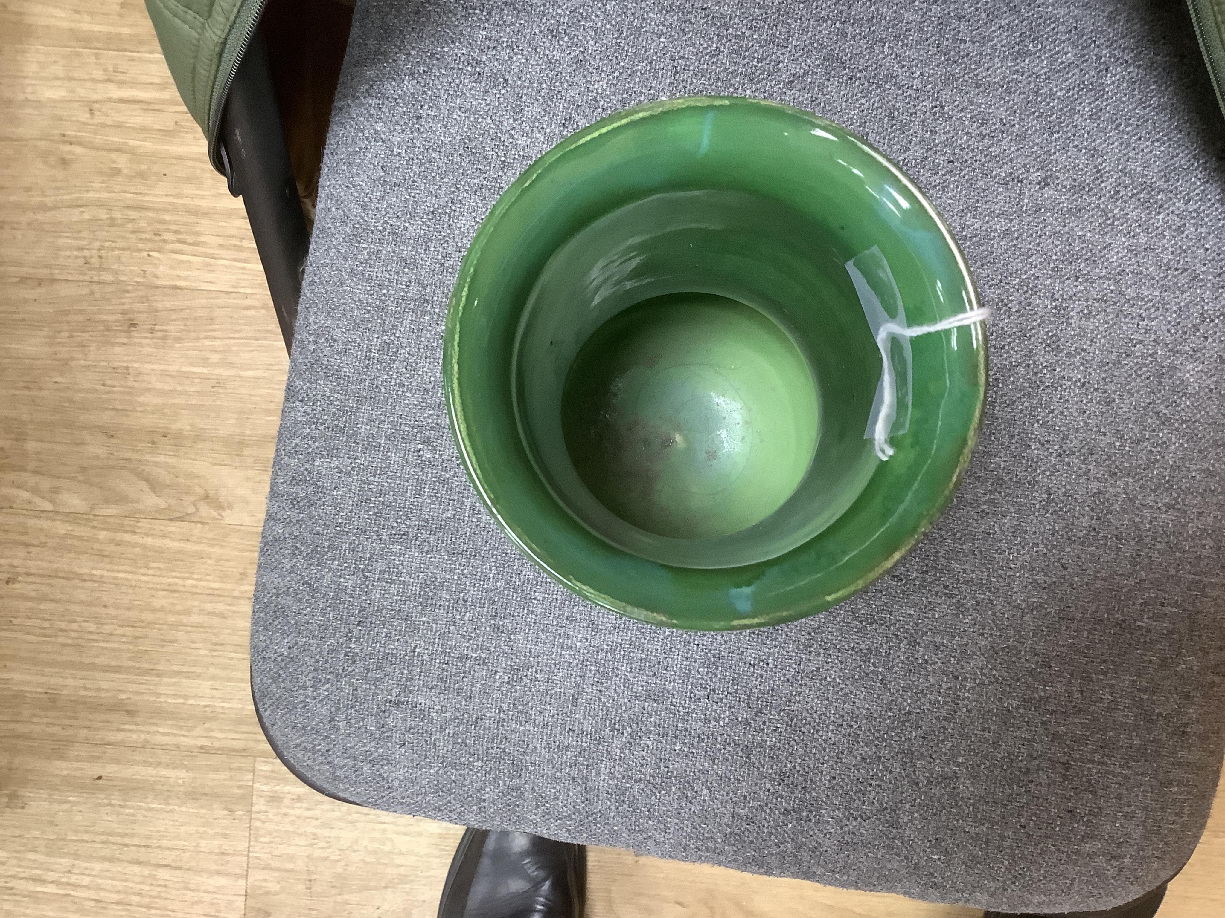 A Moorcroft for Liberty & Co. Flamminion Ware vase, and a smaller Moorcroft vase glazed in a mottled plum flambe, the first 20cm., also to include two Moorcroft reference books